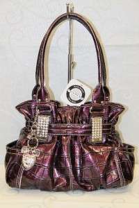 Authentic Kathy Van Zeeland Purple bag .
