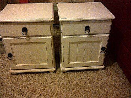 Matching pair of white bedside tables