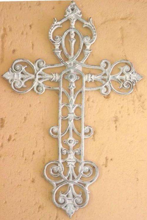 Large metal cross with detailed design