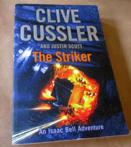 THE STRIKER - CLIVE CUSSLER AND JUSTIN SCOTT - AN ISAAC BELL ADVENTURE