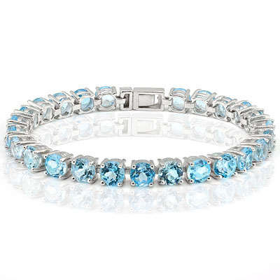 26 CT TW BLUE TOPAZ TENNIS BRACELET WITH PLATINUM OVER .925 STERLING SILVER