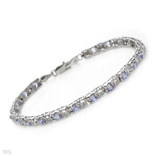 TENNIS BRACELET WITH NATURAL EYE CLEAN DIAMONDS AND TANZANITES IN 10K WHITE GOLD.