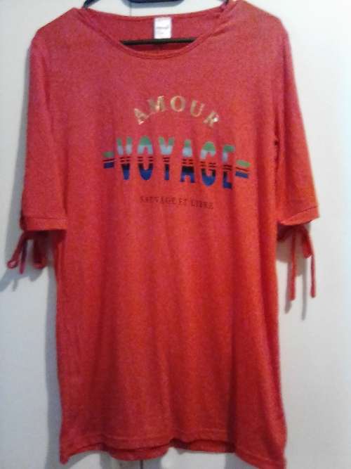 Red top with ties to pull up sleeves 32