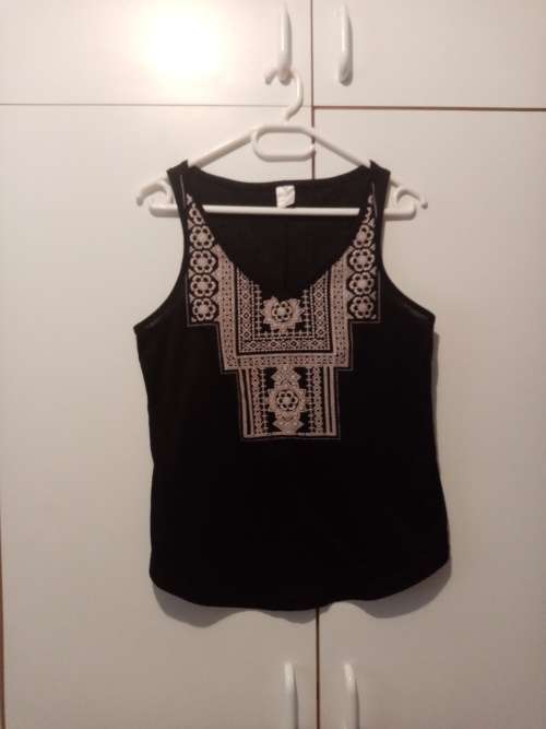 Black printed sleeveless top 32