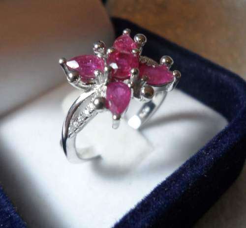 FLOWER STYLE RUBY RING SET IN SOLID STERLING