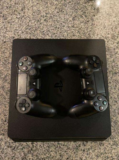 PLAYSTATION SLIM 500GB  WITH 5 GAMES and 2 CONTROLLERS