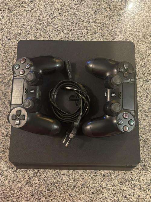 PLAYSTATION SLIM 1 TB WITH 2 GAMES and 2 CONTROLLERS