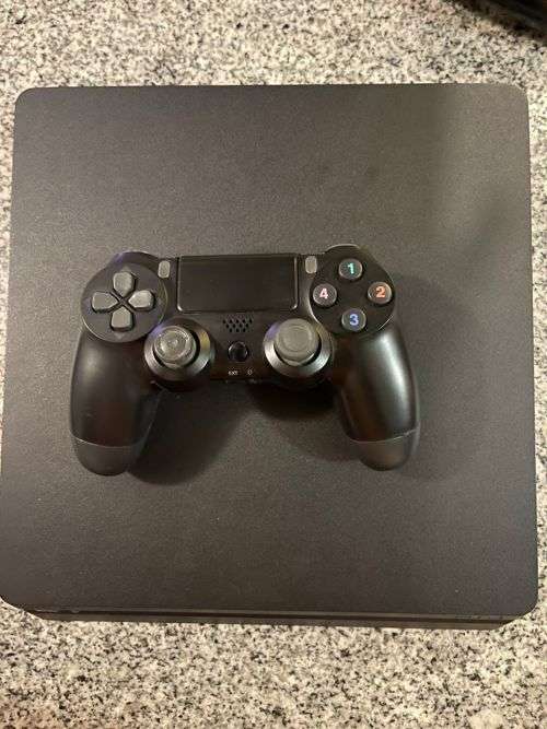 SONY PLAYSTATION 4 1TB  SLIM GOOD CONDITION  WITH 3 CONTROLLERS
