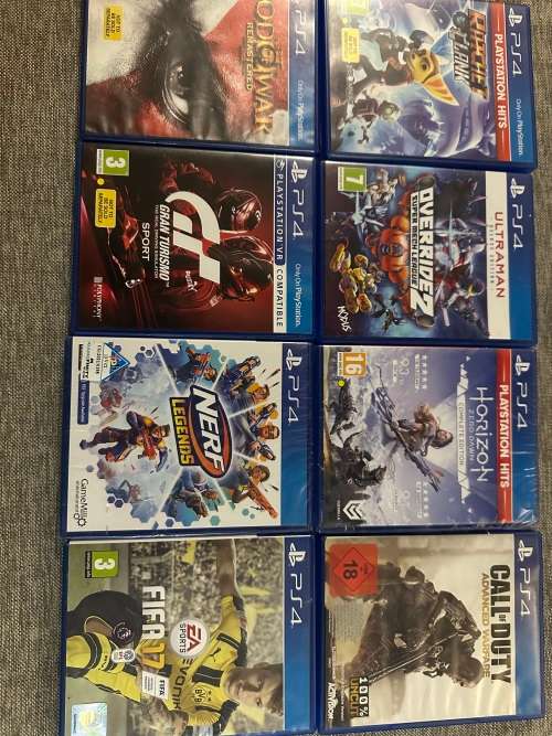 PLAYSTATION 4 SLIM 500GB WITH 8 GAMES and 2 CONTROLLERS