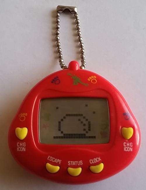 Vey Rare 90's Tamagotchi(Dinkie Dino Red)