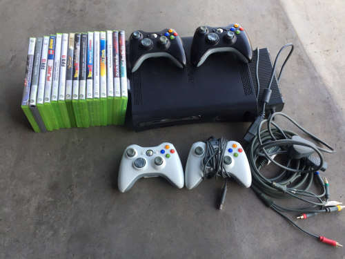 Black XBOX 360 with 4 controllers and 17 Games