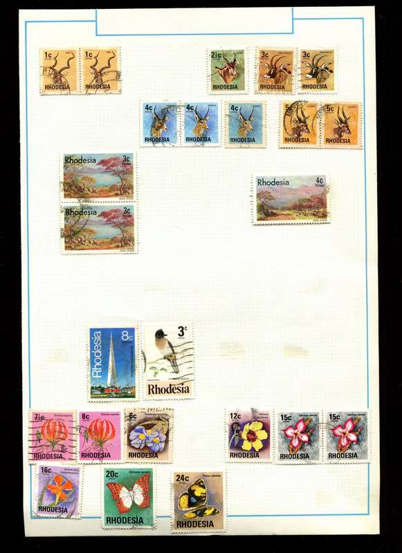 Rhodesia - 24 Stamps on Old Album Page