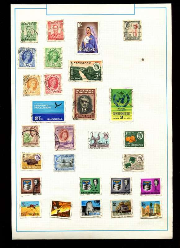 Rhodesia - 28 Stamps on Old Album Page