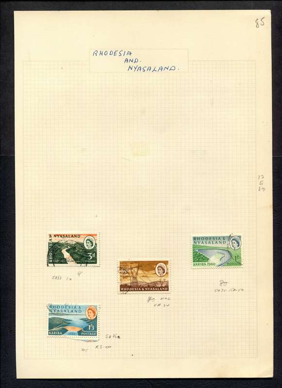 Rhodesia and Nyasaland - 4 Stamps Mounted on Old Album Page