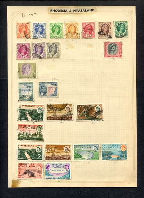 Rhodesia and Nyasaland - 24 Stamps Mounted (Hinged) On Old Album Page