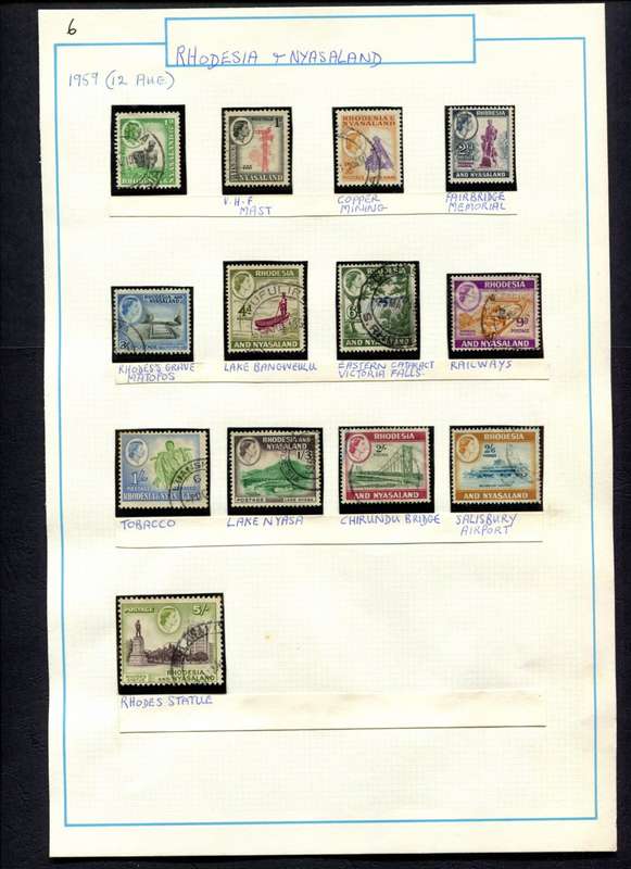 Rhodesia and Nyasaland - 13 Stamps Mounted (Hinged) on Old Album Page
