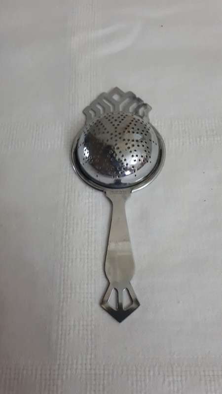 VINTAGE CHROME PLATED TEA STRAINER STAMPS/MARKS: The item is stamped Chrome Plate Made in England.