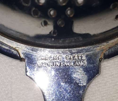 VINTAGE CHROME PLATED TEA STRAINER STAMPS/MARKS: The item is stamped Chrome Plate Made in England.