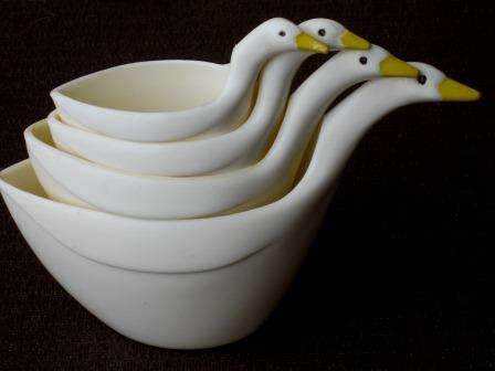 Four retro 1970s duck themed measuring ducks