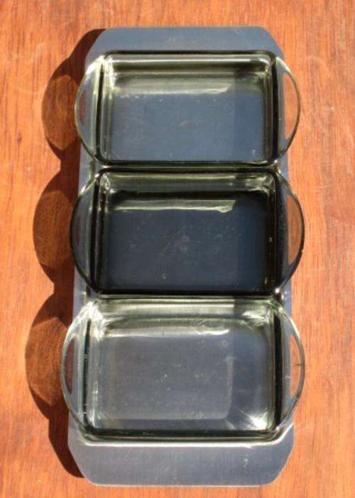 Mid century Danish Modern serving set consisting of four Holmegaard grey glass bowls and tray