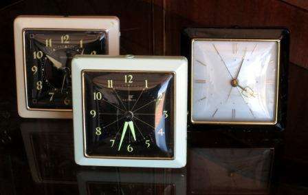 Three Art Deco Westclox alarm clocks in cream, mint green and black