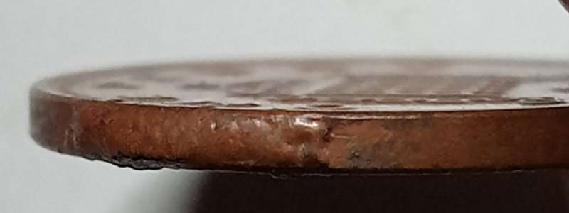 2006 GREAT BRITAIN  1 PENNY / NEW PENCE (with severe errors extra metal eroded)