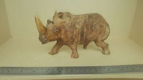 `Rhino On The Move` - Rhinoceros Sculpture Hand Carved From Zimbabwe Iron Wood.