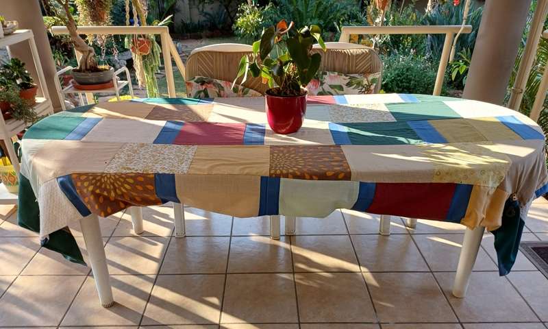 Plastic patio table plus four chairs