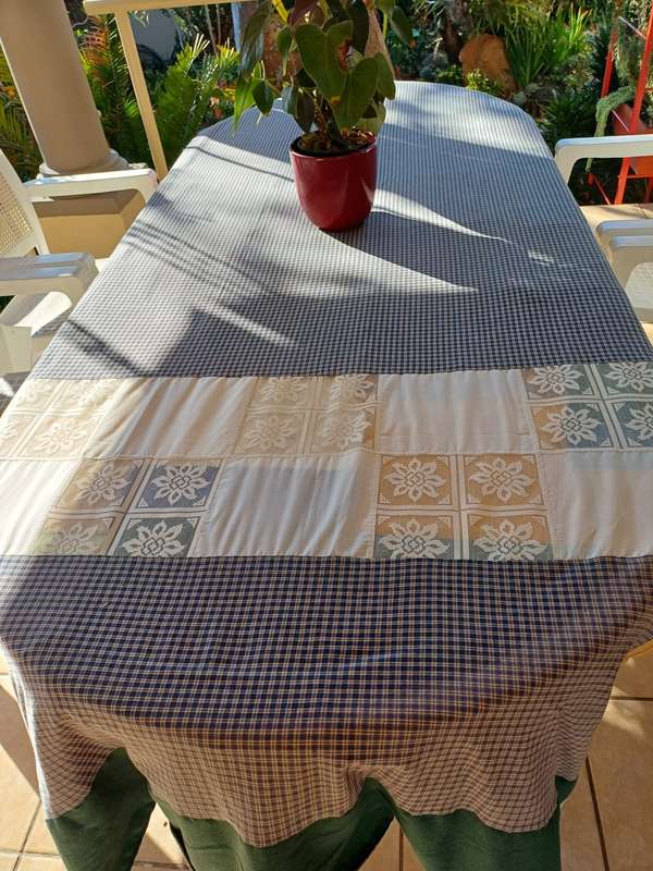Plastic patio table plus four chairs