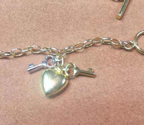 9 K / 9 carat solid Gold, Imported oval Belcher with 3 charms fob bracelet ------------mm. 3 wide