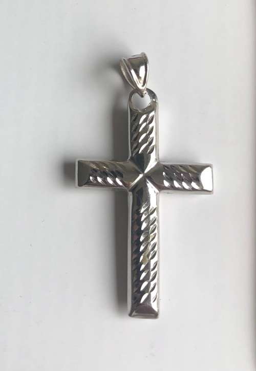 9K solid 9 carat white Gold , stunning imported cross- Shiny on one side and facetted onthe reverse
