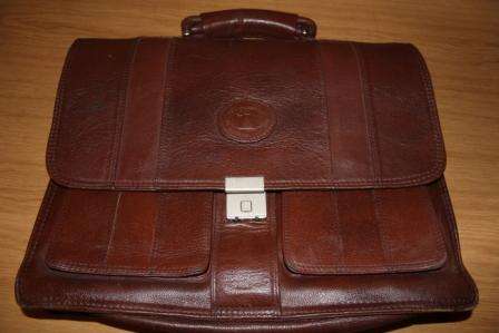 Bid or Buy Executive Director: Andy Higgins' Dooney & Bourke All Weather Leather Briefcase