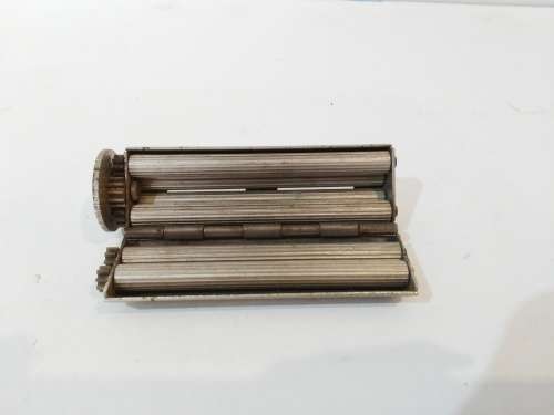 A rare cigarette rolling machine from the 1930s - marked 'CAMELIA' 'MADE IN ENGLAND'.  1" diameter x