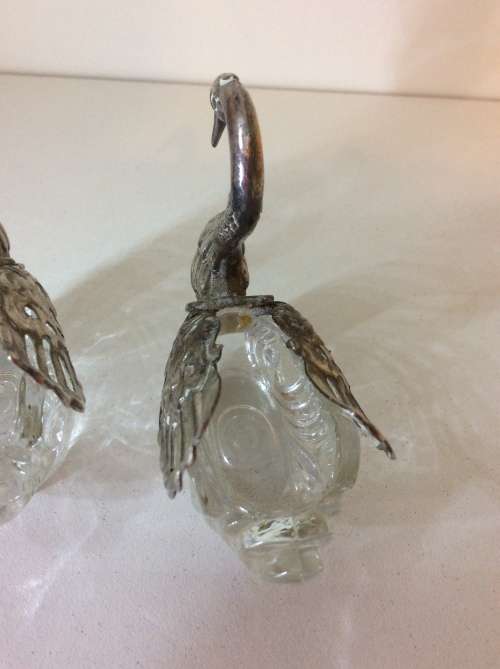 TWO GLASS AND WHITE METAL SWAN RING OR SALT HOLDERS - GREAT DETAIL - 8cm HIGH -