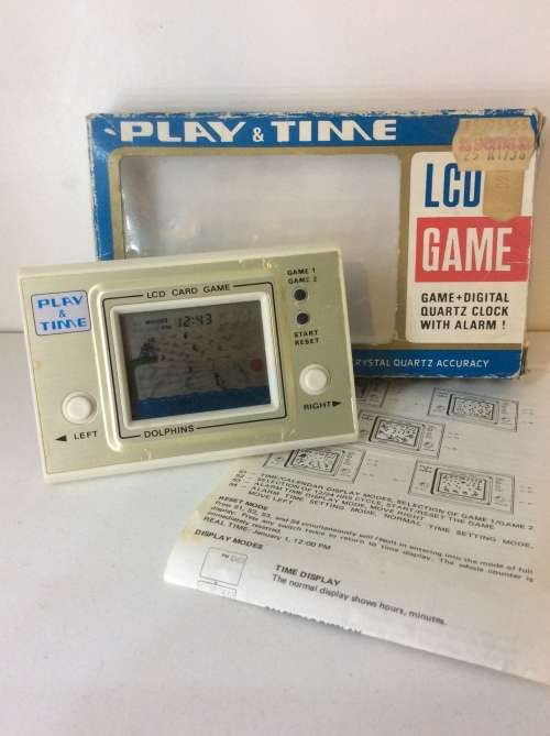 VINTAGE HAND HELD LCD GAME - DOLPHINS - WORKING -