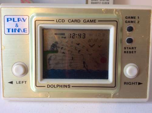 VINTAGE HAND HELD LCD GAME - DOLPHINS - WORKING -