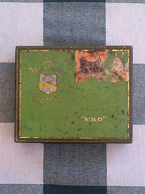 CIGARETTE TIN WITH VINTAGE STAMP: Three Castles with old Orange Free State Stamp, partial only.