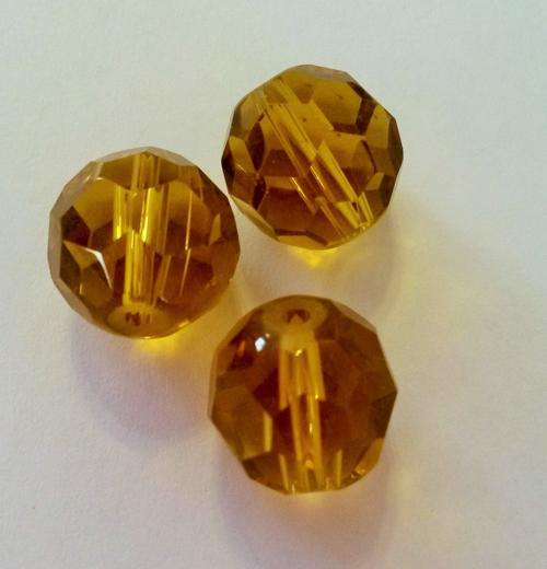 16 x 12mm round faceted yellow/amber glass beads