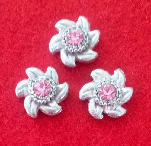 11 x 2-strand nickel spacers with a pink stone