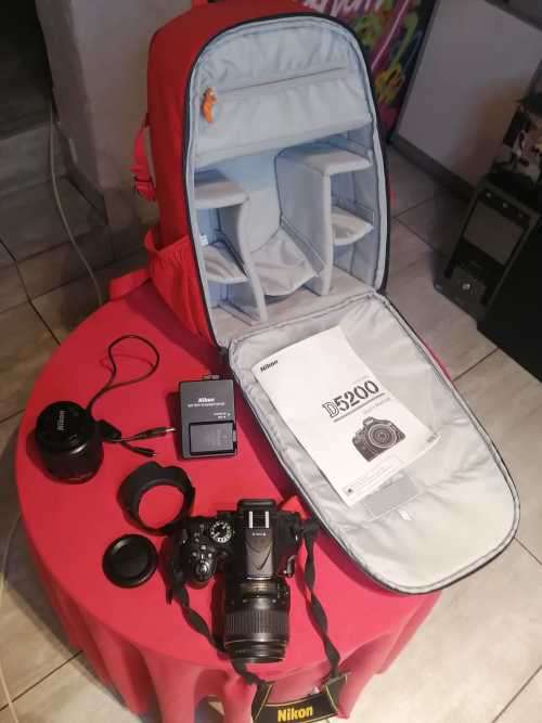 Nikon D5200 with 2 lenses, bag and SD card
