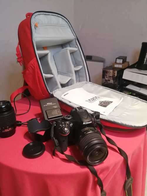 Nikon D5200 with 2 lenses, bag and SD card