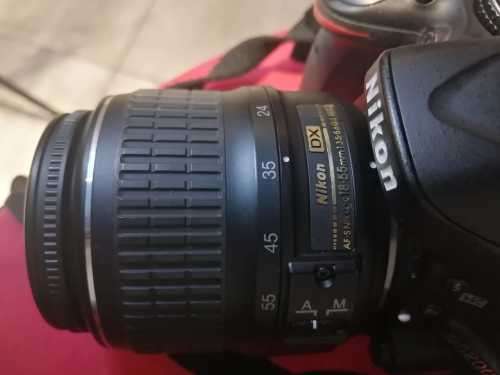 Nikon D5200 with 2 lenses, bag and SD card