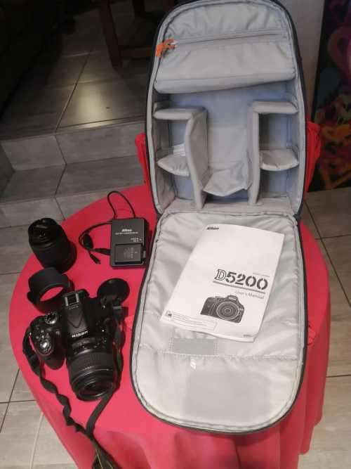 Nikon D5200 with 2 lenses, bag and SD card