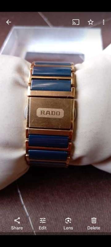 VALUED at R22000, ``RADO JUBILE` Titanium Scratchproof GOLD Case and Strap.