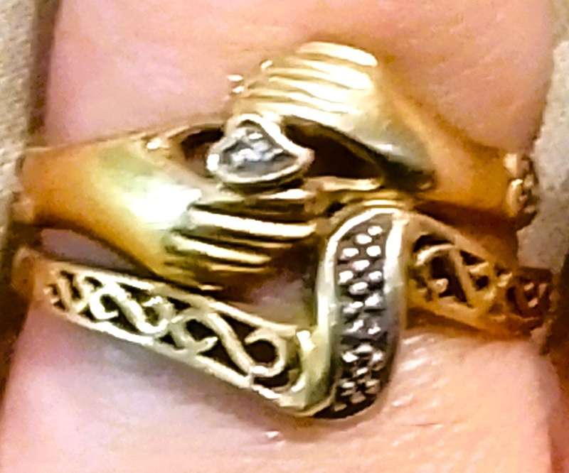 9 Ct. Gold, Designer LOVE RING with a 0.02 Carat Diamond.