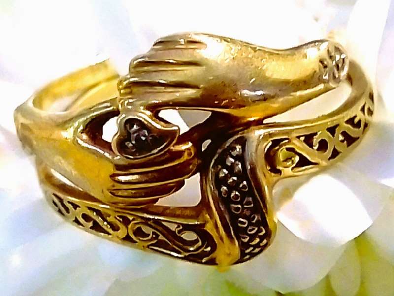 9 Ct. Gold, Designer LOVE RING with a 0.02 Carat Diamond.