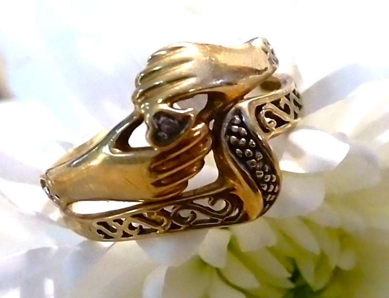 9 Ct. Gold, Designer LOVE RING with a 0.02 Carat Diamond.