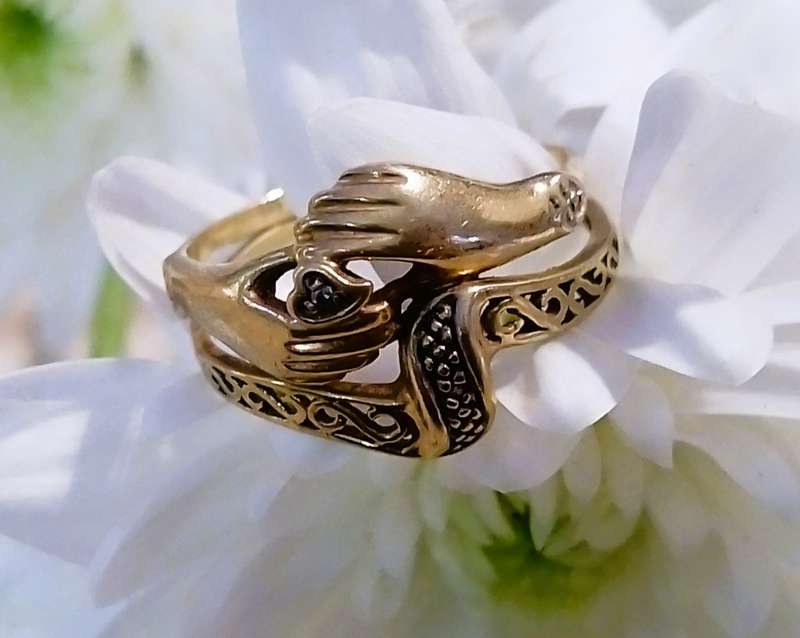 9 Ct. Gold, Designer LOVE RING with a 0.02 Carat Diamond.