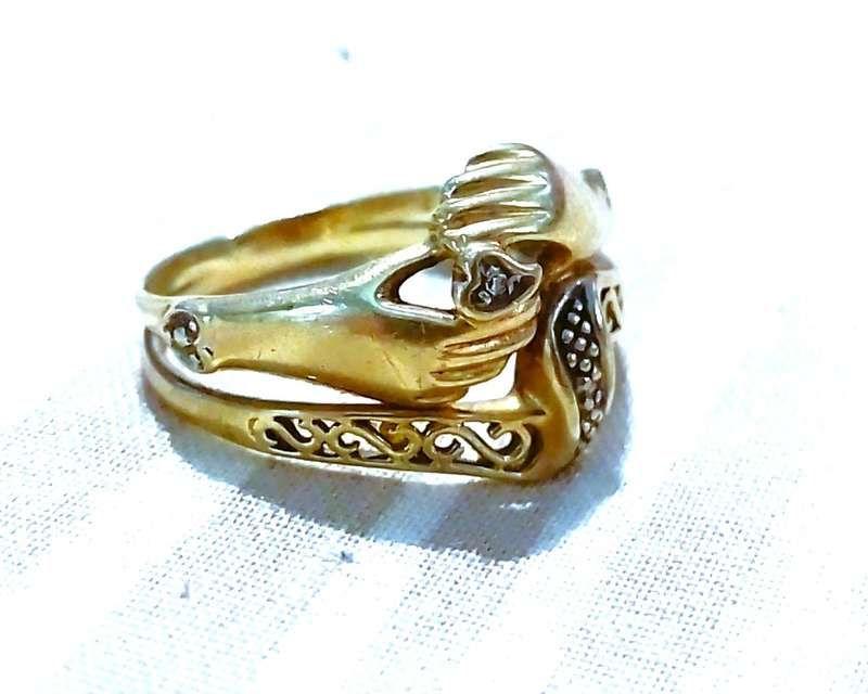 9 Ct. Gold, Designer LOVE RING with a 0.02 Carat Diamond.
