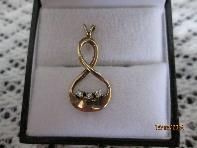 `INFINITY PENDANT` set with 3 X 0.05 Carat Natural Diamonds, set in 9ct Yellow Gold